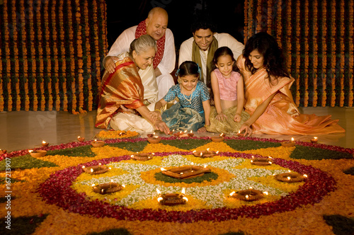 Konstfotografi Family sitting near rangoli