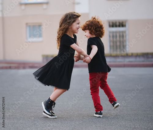 boy and girl dancing on the street