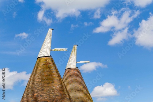 Oast house with flower field in the front in Sussex, UK photo