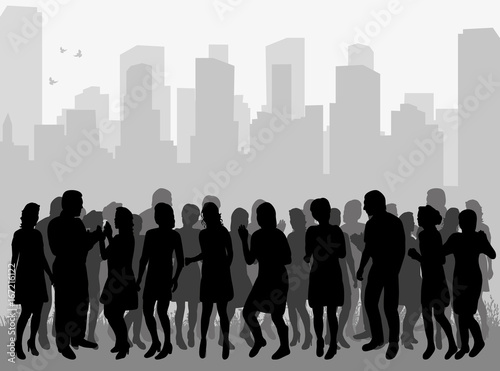 Vector silhouette of a crowd of people dancing against a city background