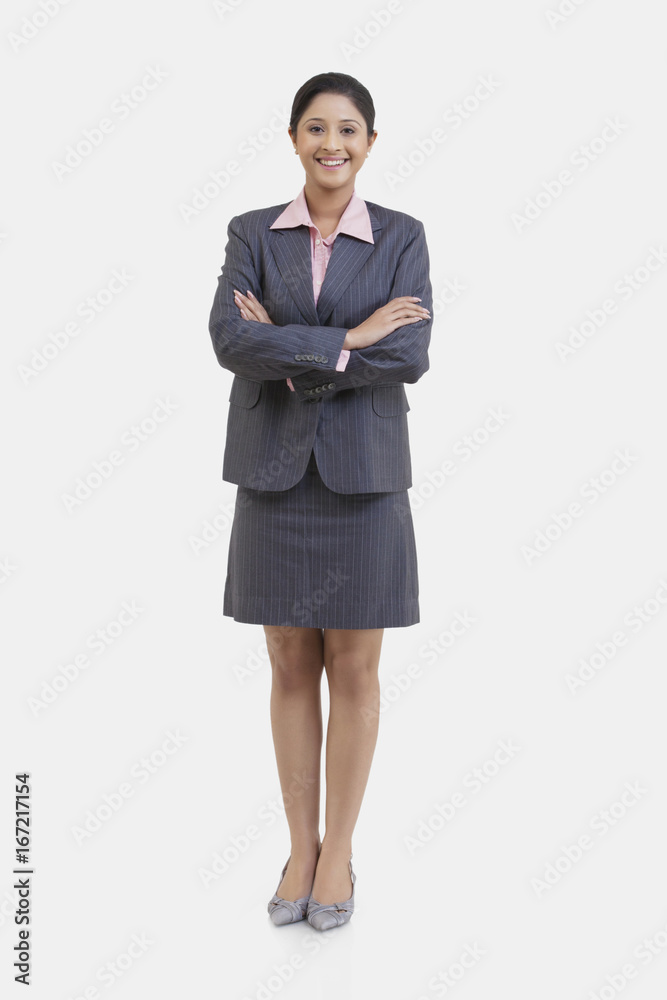 Portrait of young businesswoman with arms crossed isolated over white background Portrait of young businesswoman with arms crossed isolated over white background