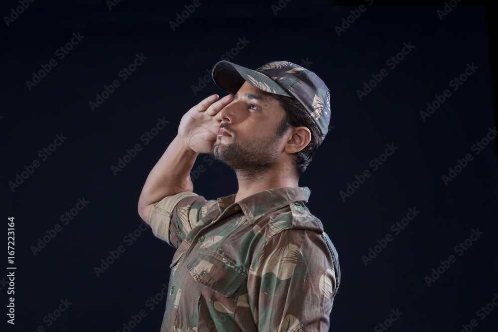 Handsome Indian soldier saluting Handsome Indian soldier saluting