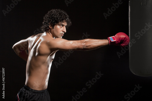 Man working out with a punching bag  © IndiaPix
