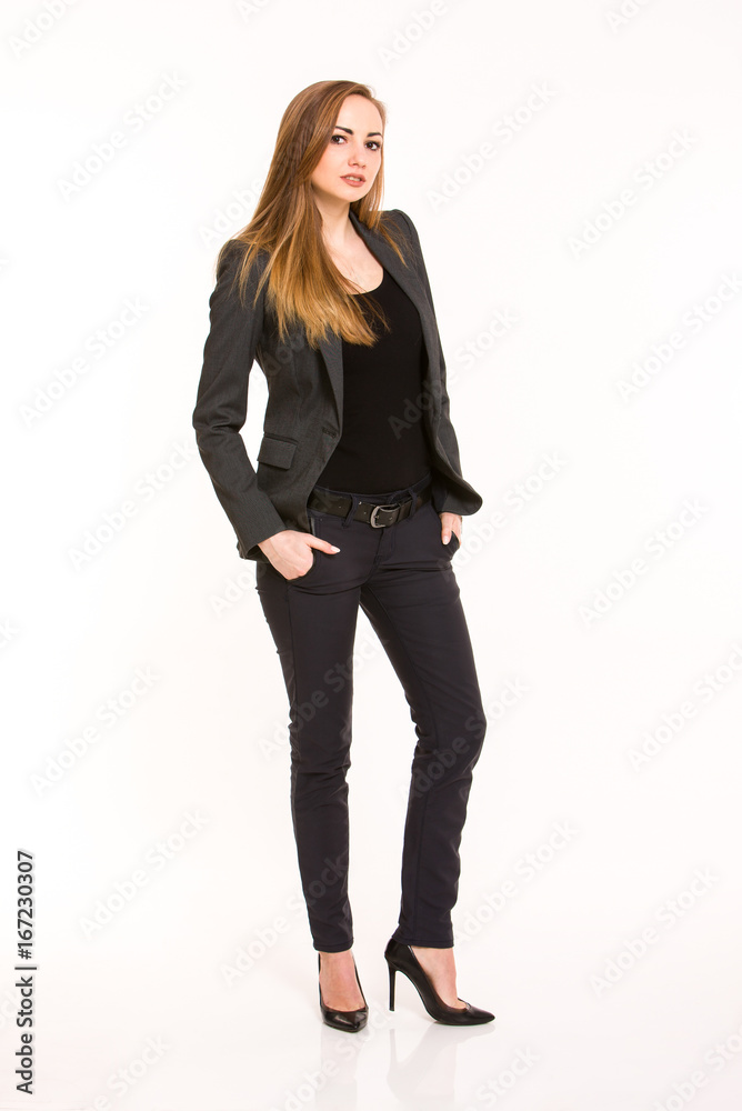 Dark blonde woman wearing smart casual outfit with hands in the pockets Dark blonde woman wearing smart casual outfit with hands in the pockets