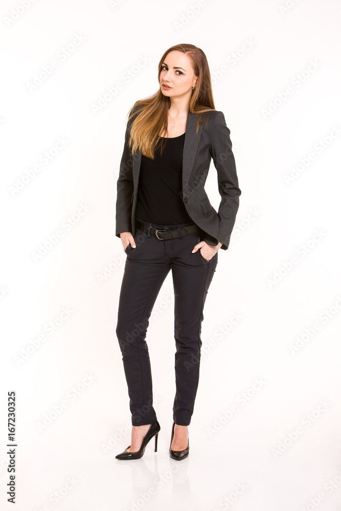 Dark blonde woman wearing smart casual outfit with hands in the pockets Dark blonde woman wearing smart casual outfit with hands in the pockets