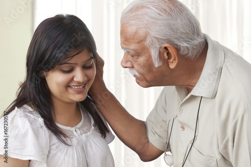 Wallpaper Mural Grandfather pulling ears of granddaughter Torontodigital.ca