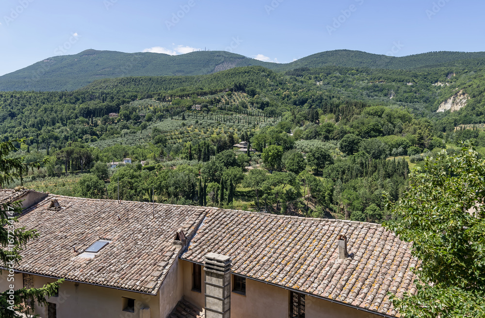 Aerial view of rooftops and Tuscan countryside in Cetona, Siena, Italy, on a sunny day Aerial view of rooftops and Tuscan countryside in Cetona, Siena, Italy, on a sunny day