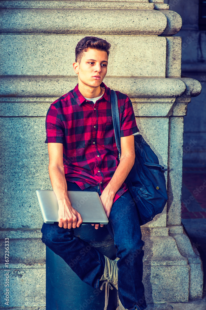 American College Student relaxing on street in New York American College Student relaxing on street in New York