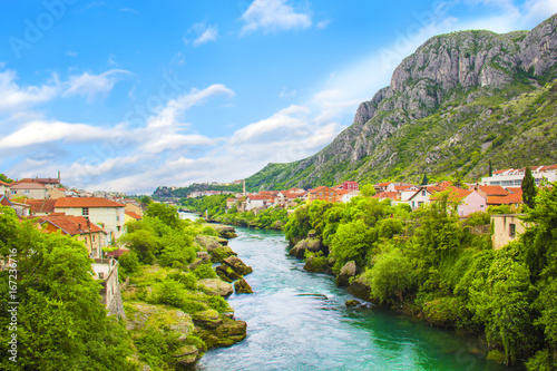 A beautiful view of the Neretva River in Mostar  Bosnia and Herzegovina  on a sunny summer day