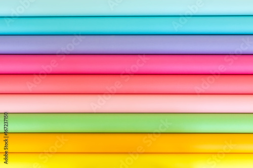 Colorful bright rolls of a paper arranged in a row