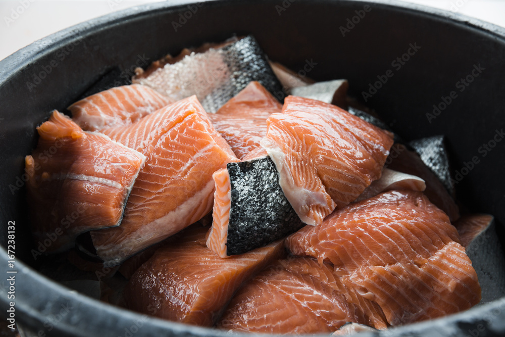 Bucket full of fresh cut salmon fillets with skin Stock Photo Adobe Stock