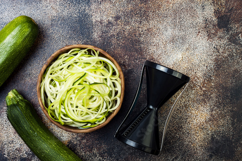 Zucchini spaghetti or noodles (zoodles) bowl. Top view, copy space photo