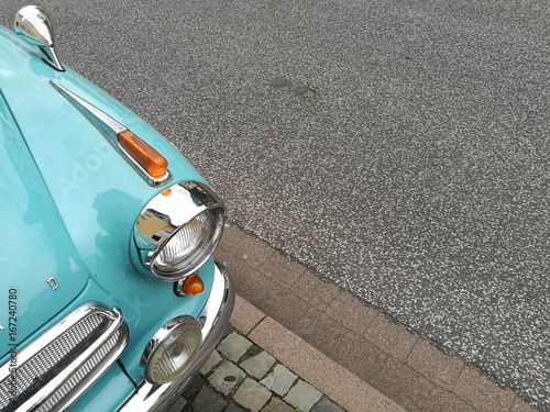 Deutsche Limousine der Fünfzigerjahre mit viel Chrom auf grauem Asphalt in der Hauptstraße beim Oldtimertreffen Golden Oldies in Wettenberg Krofdorf-Gleiberg bei Gießen in Hessen photo