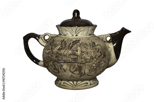 Brown kettle made of clay with a picture on its back