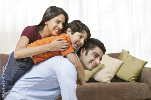 Happy Indian family of three at home 
