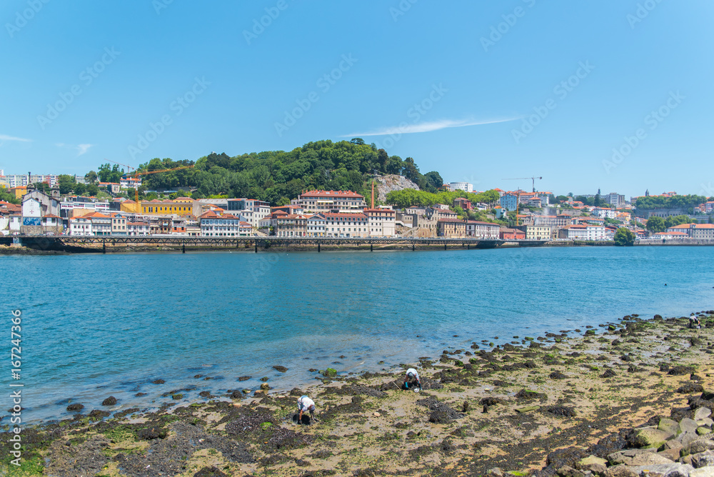 Porto, in Portugal, people fishing from the shore, view of the Douro
