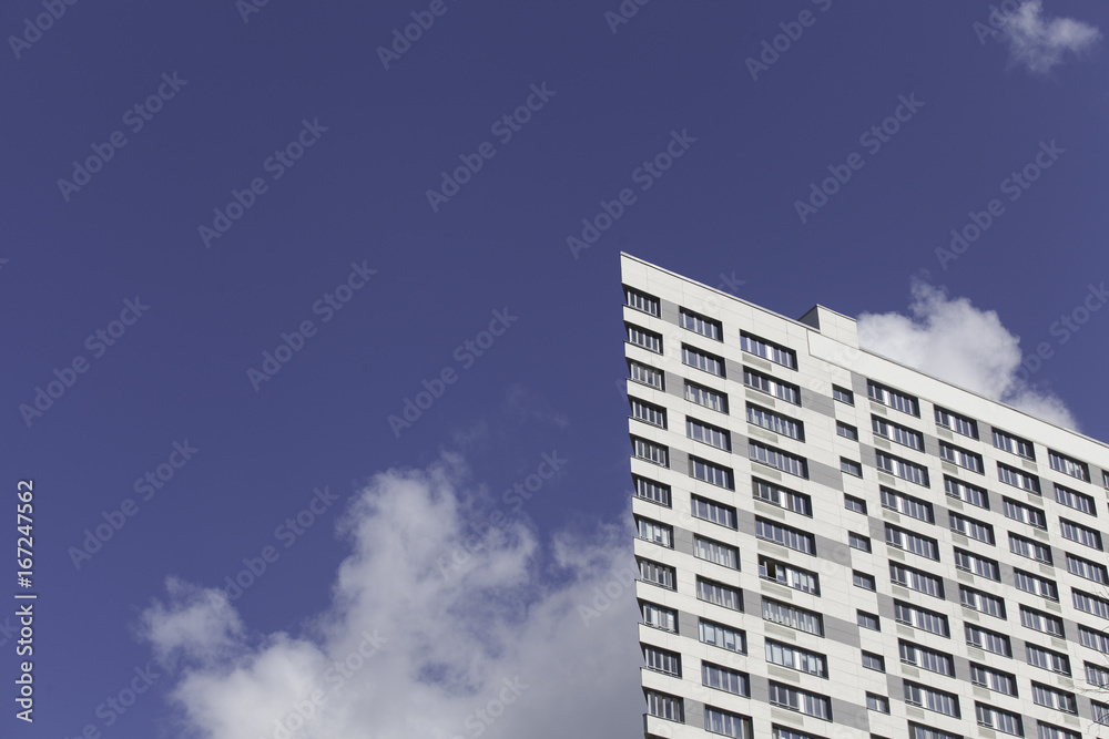 A part of modern business building against blue sky