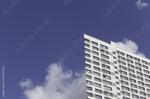 A part of modern business building against blue sky