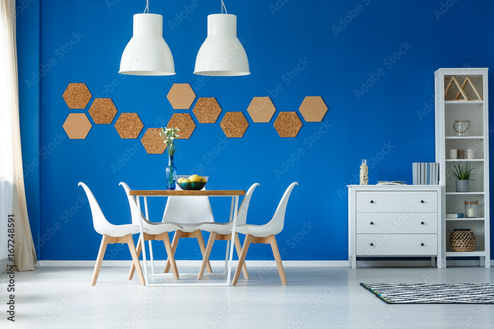 Fototapeta premium Blue walls and simple furniture