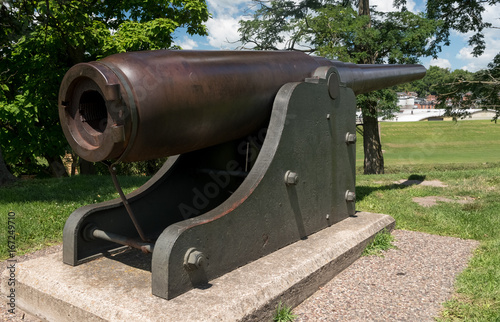 Very old artillery canon in a park photo