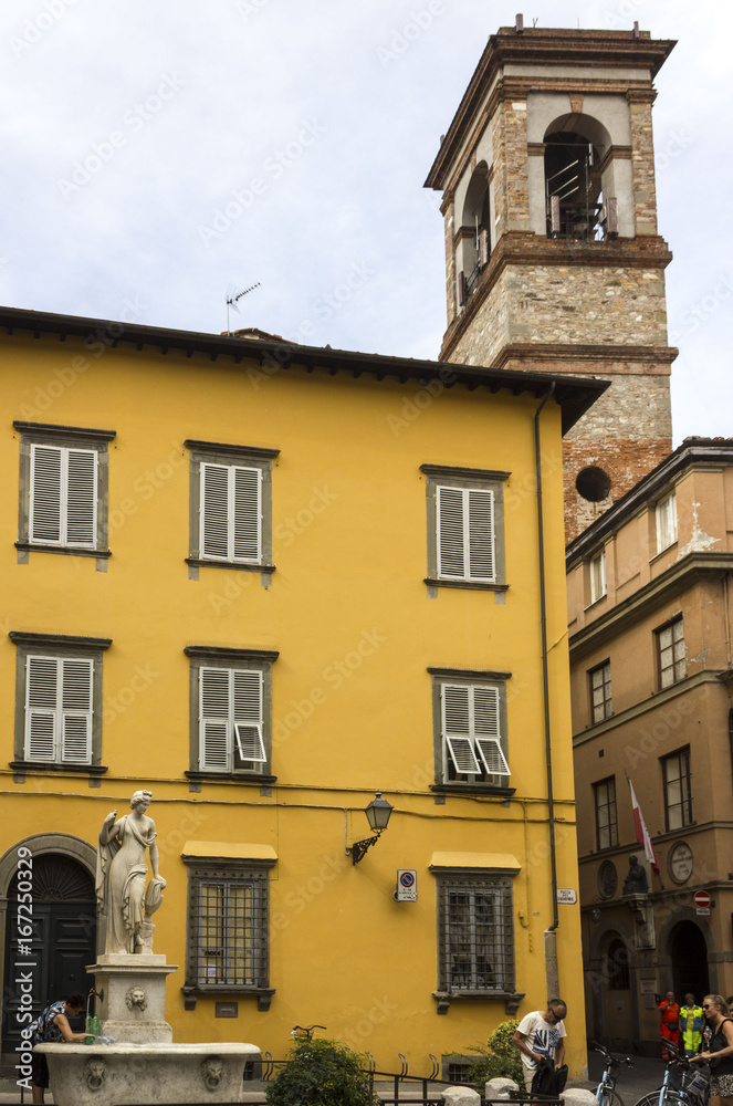 LUCCA, ITALY - AUGUSt 15 2015: Piazza del Salvatore square in Lucca, with a fountail and tower