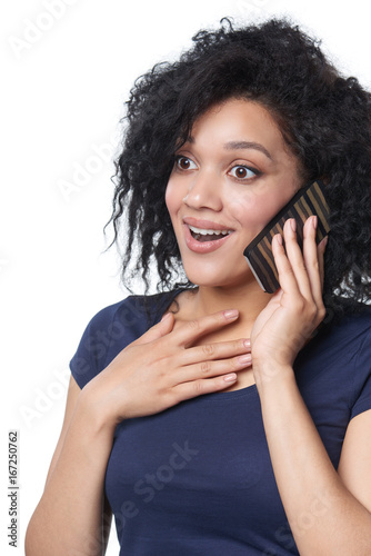 Surprised emotional woman talking on mobile phone