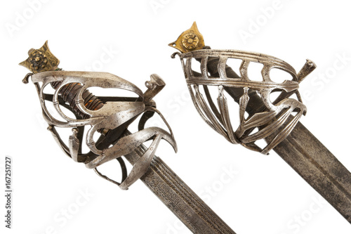 Fotografia A pair of antique Venetian or Dalmatian broadsword hilts, isolated on white