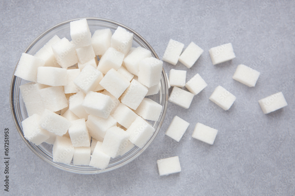 White sugar cubes on gray background from top view White sugar cubes on gray background from top view
