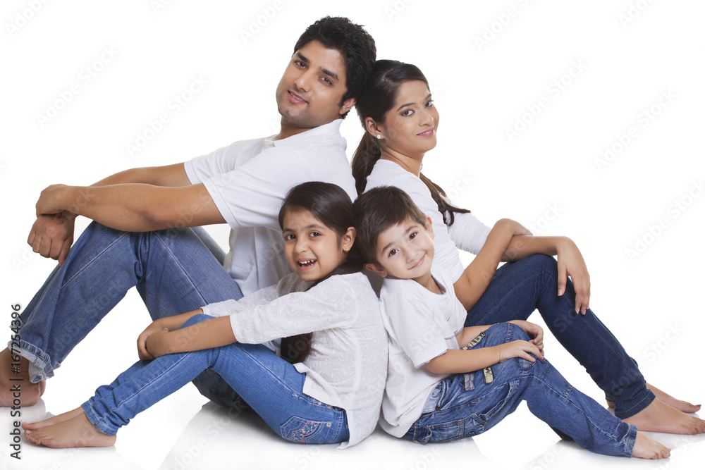 Portrait of happy family sitting over white background Portrait of happy family sitting over white background