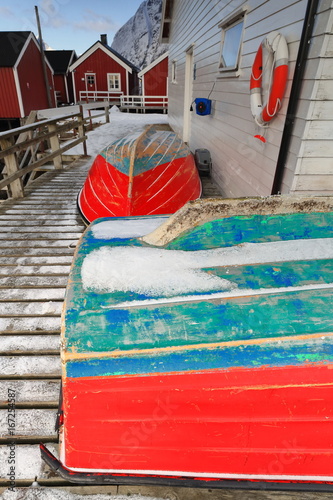 Small fishing boats ashore upon wooden pier-harbor's W.side. Hamnoy-Reine-Lofoten-Norway. 0242 photo