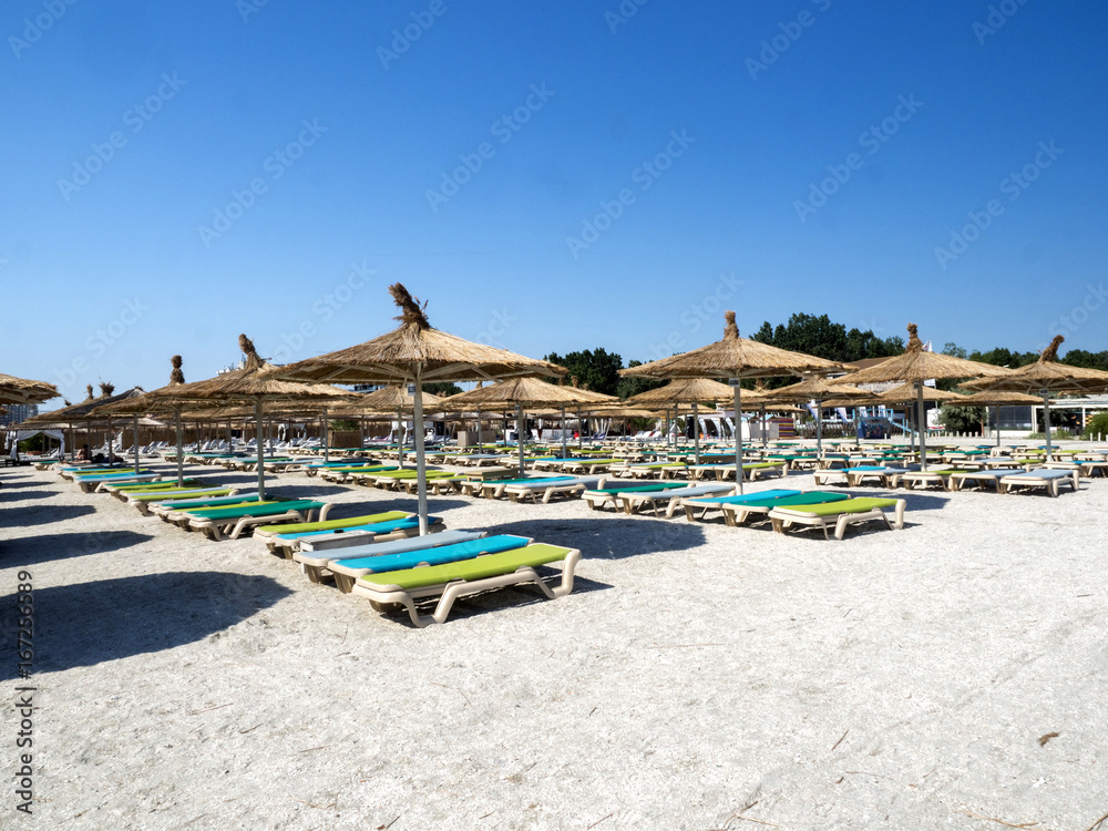 MAMAIA, ROMANIA -JULY ¨20:, 2017 Empty beach with umbrellas and sun loungers , July 20, 2017 in  Mamaia, Romania