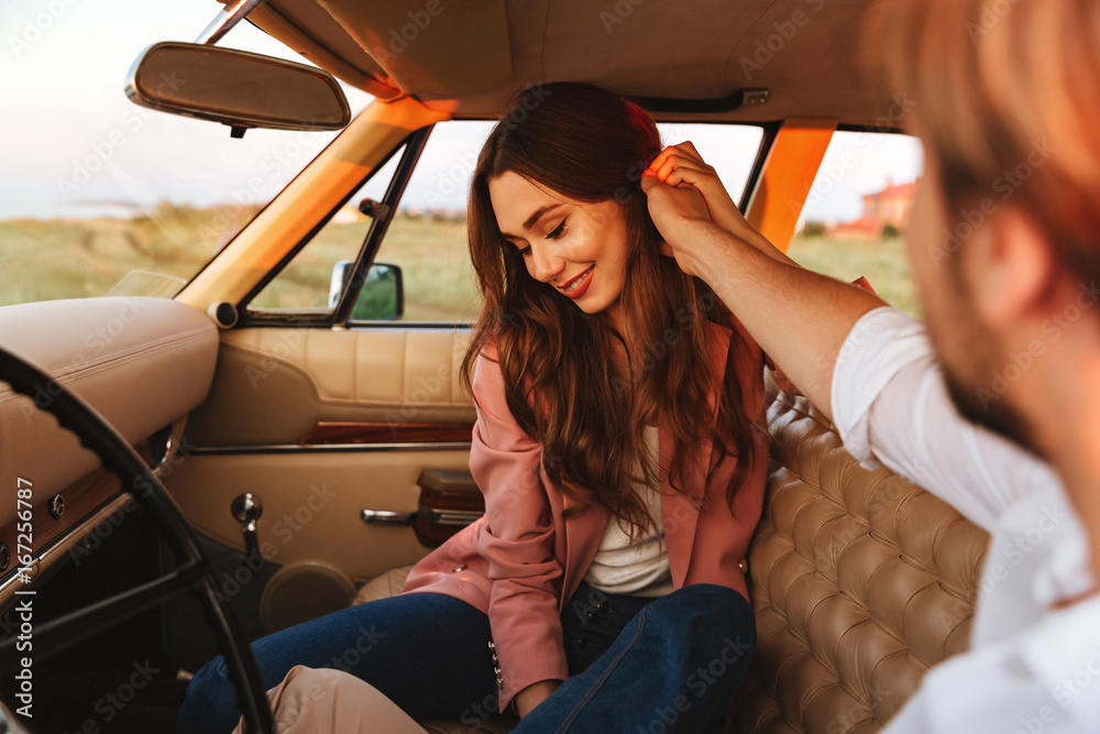 Ταπετσαρία Young man flirting with his girlfriend by touching her hair