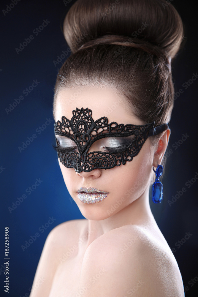 Glamour Makeup. Beauty fashion girl with sparkle silver lipstick wears in  lace black mask and gems earrings over dark blue studio background. Stock  Photo | Adobe Stock