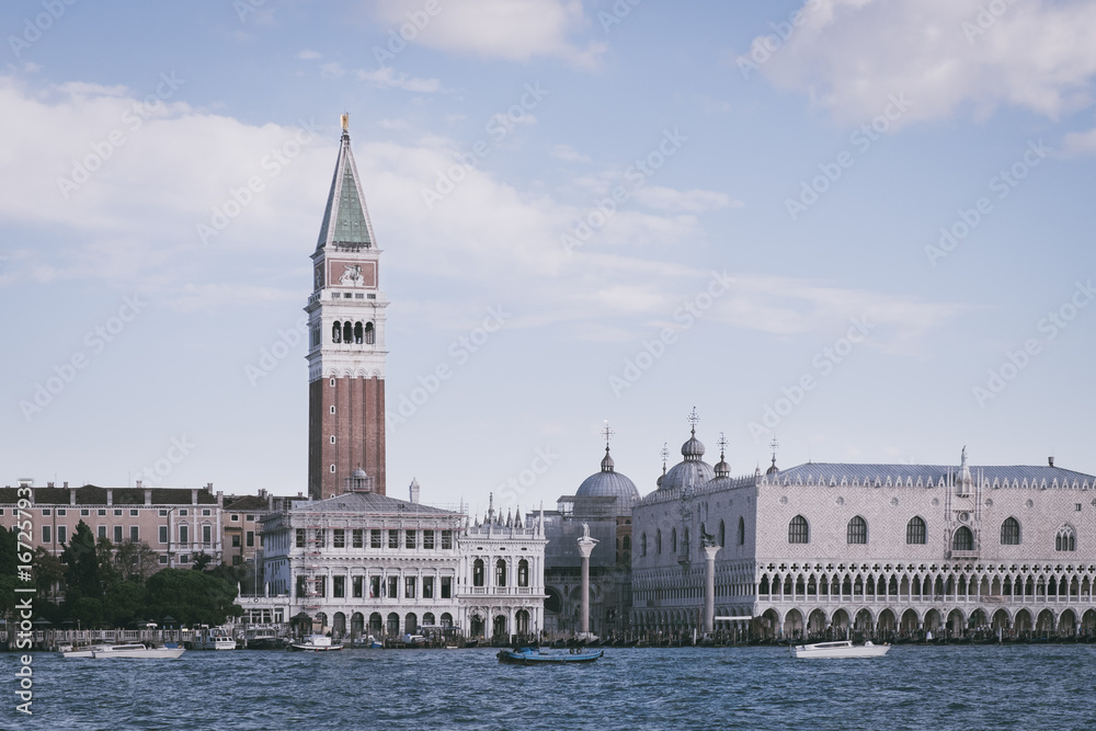 Piazza San Marco background, Viewpoint from canal, Italy Beautiful view of famous romantic traditional Canal Grande with Bell tower and Doge's Palace in Venice Italy, San Marco under Clear Sky Summer