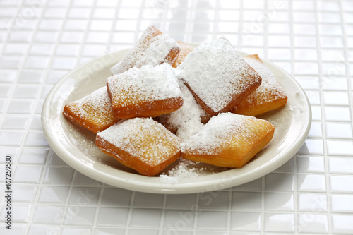homemade new orleans beignet donuts with plenty of powdered sugar