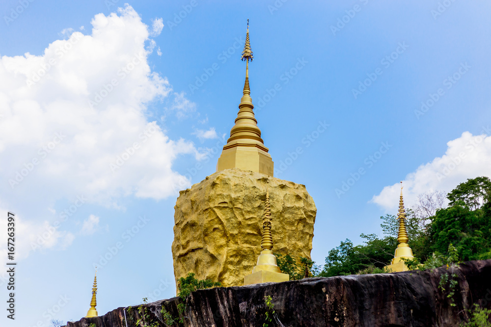 Naklejka premium golden pagoda and golden stone at wat tham pha daen in sakon nakhon thailand.