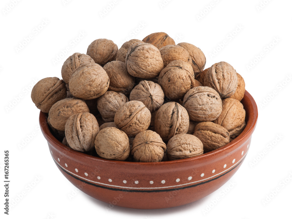 Ceramic bowl full of walnuts isolated on white background Ceramic bowl full of walnuts isolated on white background