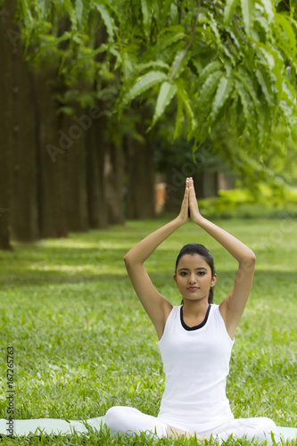 Portrait of young woman in yoga position  © IndiaPix