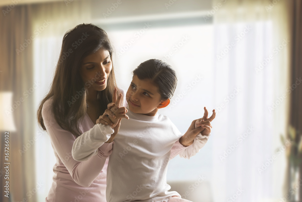 Happy mother embracing daughter and having fun Happy mother embracing daughter and having fun