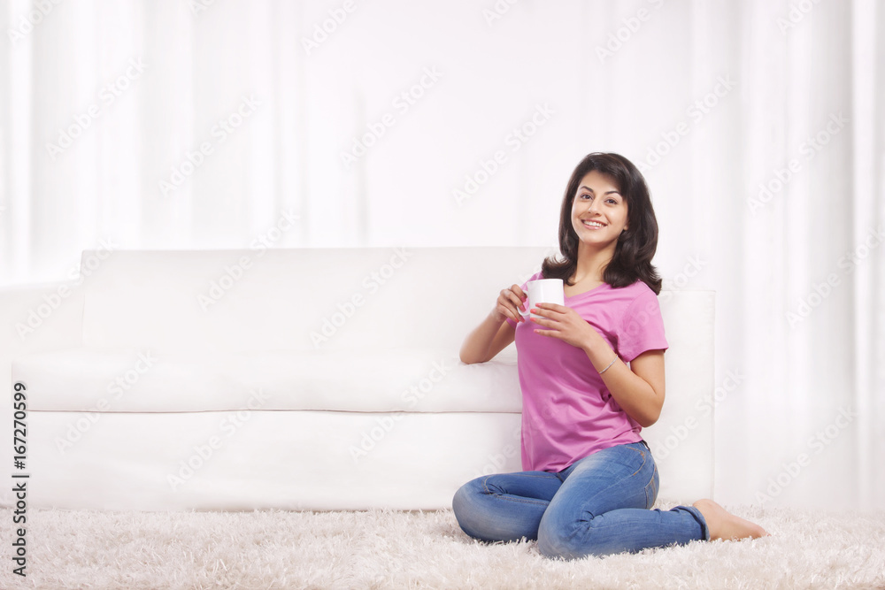 Portrait of a woman drinking tea