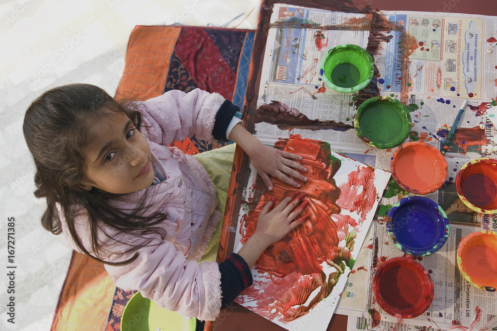 Fototapeta premium Little girl painting