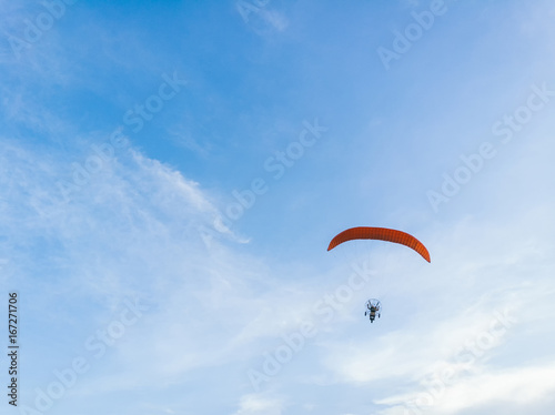 man ride Paramotor flying in the sky