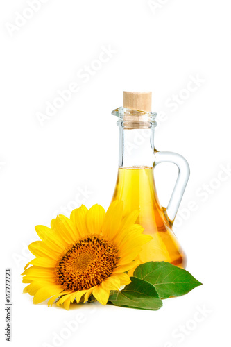 Beautiful sunflowers and sunflower oil on a white background.