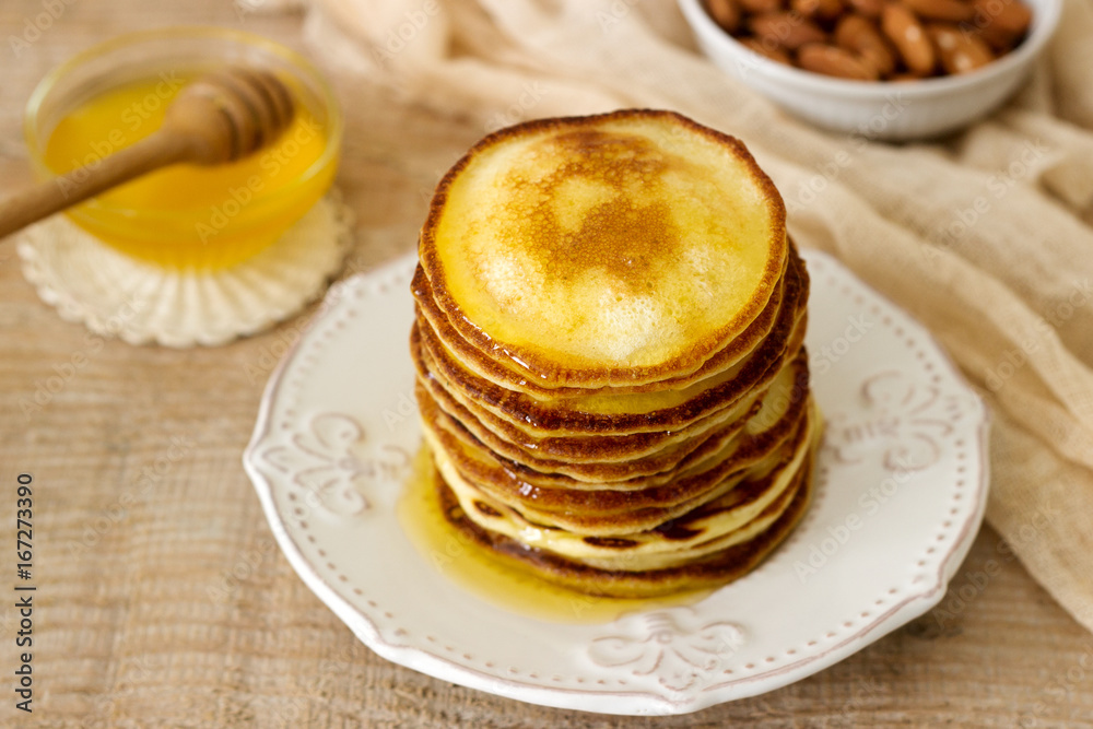 Homemade pancakes with honey and nuts, breakfast. Homemade pancakes with honey and nuts, breakfast.