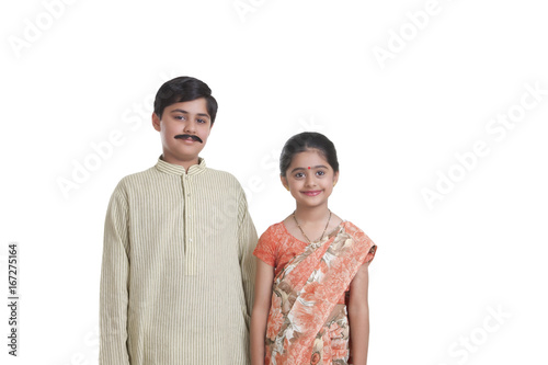 Portrait of kids dressed as husband and wife