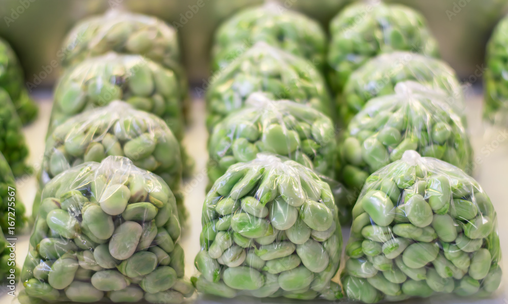 Fototapeta premium Broad beans inside plastic bags.