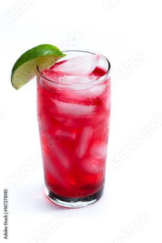 red cocktail with a lime