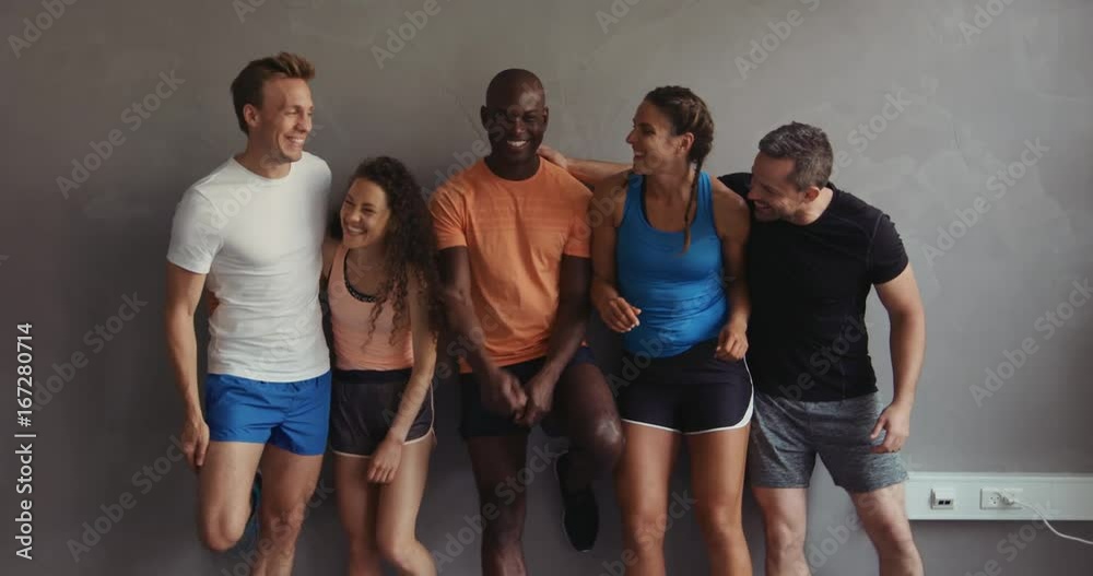 Group of friends laughing together after a gym workout