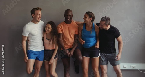 Group of friends laughing together after a gym workout