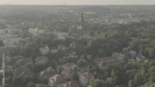 Aerial of Dresden Neustadt with view to the Martin Luther Church, Drone view over the baroque city, green trees, log, 4K 